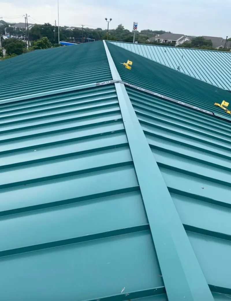 Green commercial metal roof ridge and valley for Metal Roof Repair in North Cornwall
